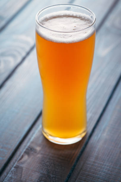 istock Pale ale on blue wood 954240746
