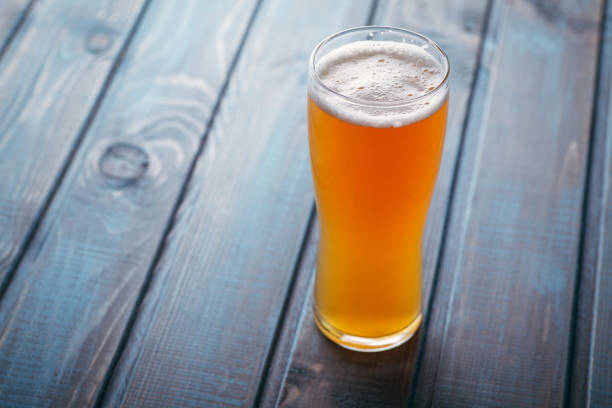 istock Pale ale on blue wood 954240750