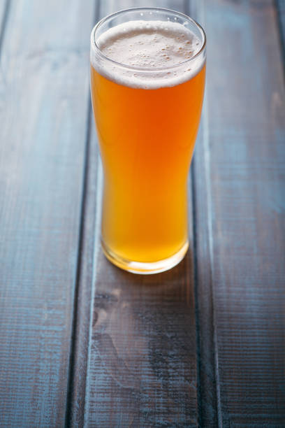istock Pale ale on blue wood 954240832