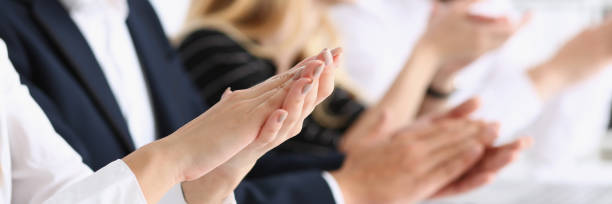 group of people clap their arm in row during - hands clasped business education cooperation imagens e fotografias de stock