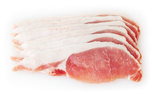 Raw pork meat isolated on white background with clipping path Raw pork meat isolated on white background with clipping path uncooked bacon stock pictures, royalty-free photos & images