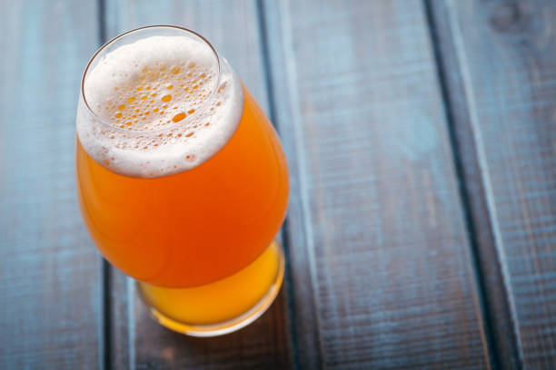 istock Pale ale on blue wood 954241042