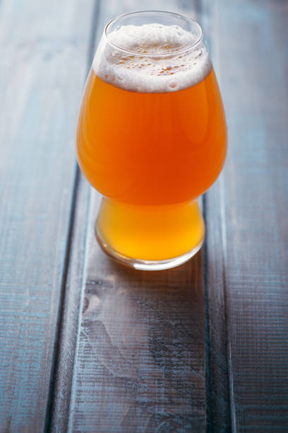 istock Pale ale on blue wood 954241052