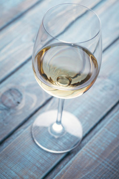 istock White wine on blue wood 954241194