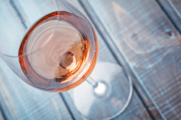 istock Rose wine on blue wood 954241300
