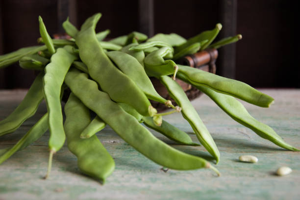 istock Fresh green pods of flat beans 954245260