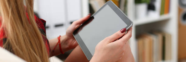 istock young woman hold laptop in arms work 954245470