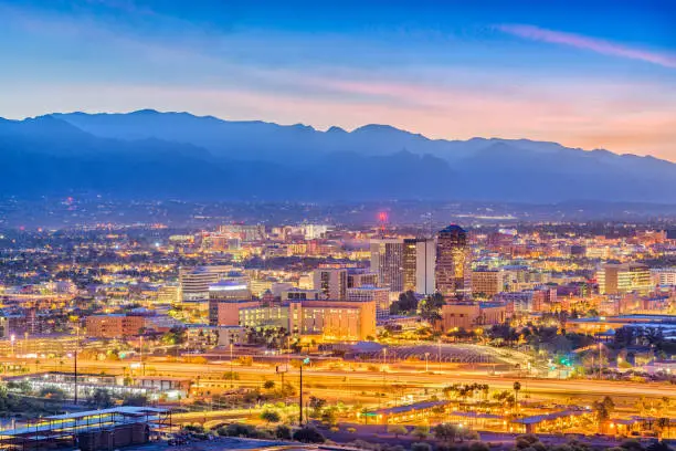 Tucson, Arizona, USA downtown skyline from Sentinel Peak at dawn.