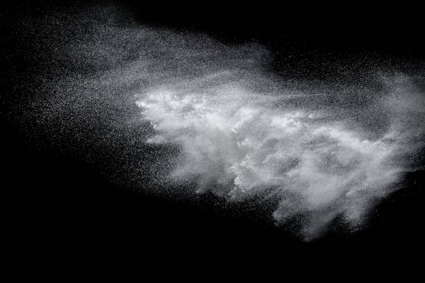 istock Launched white powder splash on black background. Bizarre forms of of white powder explosion cloud against dark background. 954250644