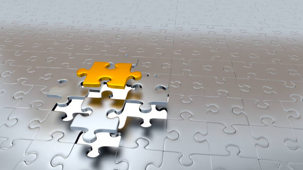 istock One Gold Puzzle Piece escaping from other Pieces 954250788