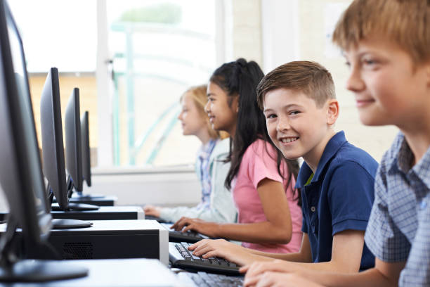 istock Portrait Of Line Of Elementary Pupils In Computer Class 954250956