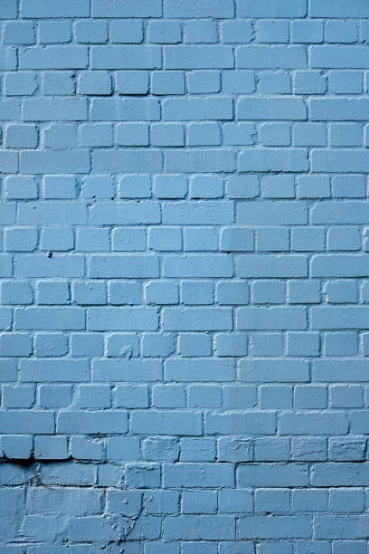 istock Close up of an old brick wall painted blue, featuring a nice surface texture. 954251842