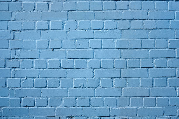 istock Close up of an old brick wall painted blue, featuring a nice surface texture. 954251956