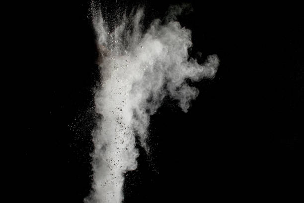 istock Launched white powder splash on black background. Bizarre forms of of white powder explosion cloud against dark background. 954252174