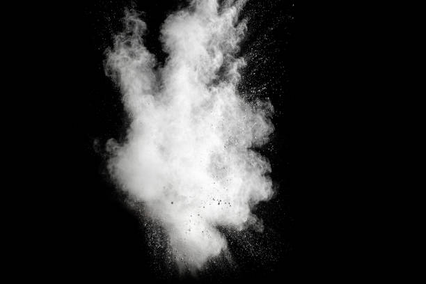 istock Launched white powder splash on black background. Bizarre forms of of white powder explosion cloud against dark background. 954252212