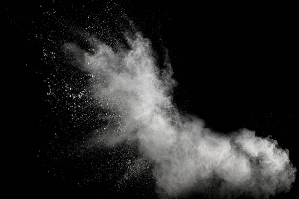 launched white powder splash on black background. bizarre forms of of white powder explosion cloud against dark background. - wind effect imagens e fotografias de stock