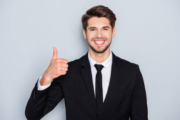 istock Cheerful successful happy businessman showing thumb up 954256310