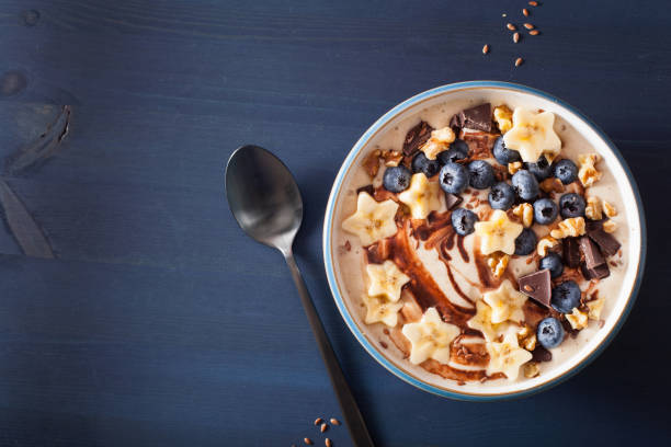 istock healthy banana smoothie bowl with blueberry chocolate walnuts 954259602