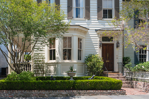 Facade of historic architecture in the residential old town neighborhood of Charleston, South Carolina.