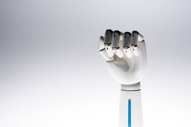 istock robot hand showing fist isolated on grey 954261092
