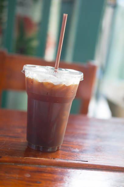 istock Ice black coffee cup on the table drink in counter bar 954261446
