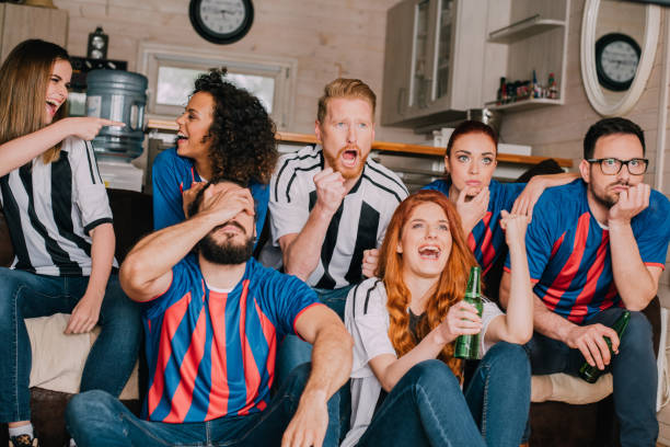 istock Multi-gender group of soccer fans watching a game 954261984