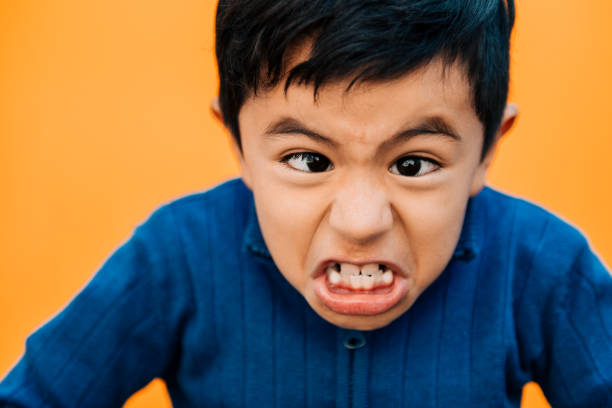 istock Angry Little boy Crossing Eyes 954264844