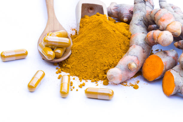 istock fresh turmeric root and turmeric powder  on white background 954265454