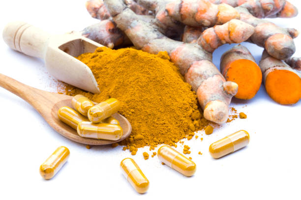 istock fresh turmeric root and turmeric powder  on white background 954266062
