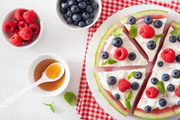 istock watermelon pizza slices with yogurt and berries, summer dessert 954266086