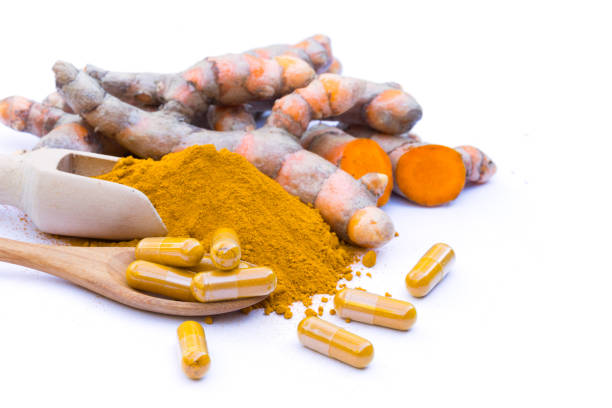 istock fresh turmeric root and turmeric powder  on white background 954266096