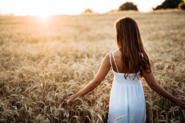 istock Young beautiful woman spending time in nature 954267420