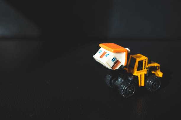istock Miniature tracktor lift mini house 954267766