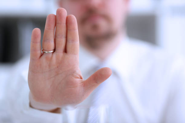 istock Male arm show palm during conference conversation 954267780