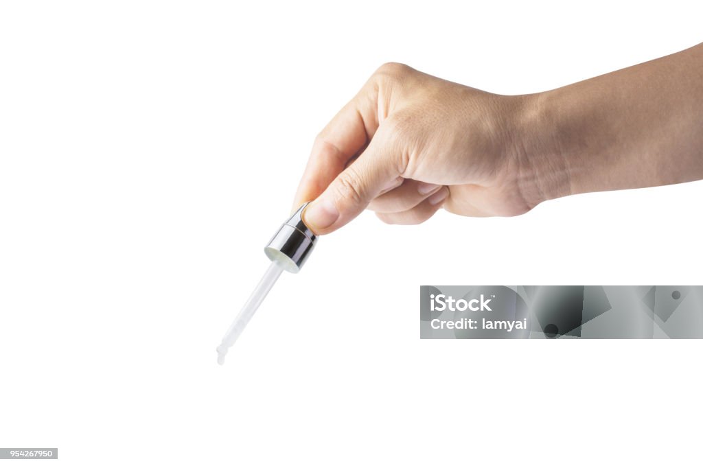 woman hands hold glass dropper isolated on white background, File contains a clipping path. Adult Stock Photo