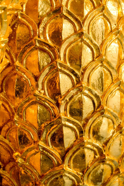 istock gold stucco design of native thai style on the Wall 954274256
