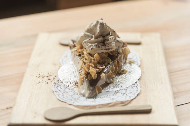 istock cake on wooden plate in coffee shop 954282236