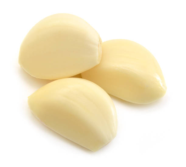 istock Garlic clove isolated on white 954289700