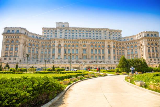 Building of Romanian parliament in Bucharest is the second largest building in the world Bucharest, Romania - April 26, 2018: Building of Romanian parliament in Bucharest is the second largest building in the world, Rumania bucharest people stock pictures, royalty-free photos & images