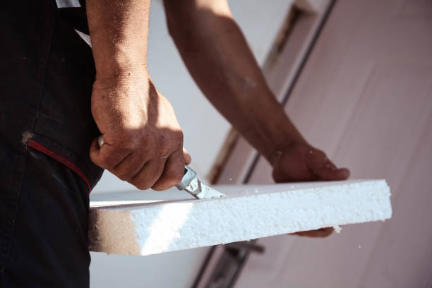 istock Worker Cutting Insulated Concrete Form for House Construction 954300704