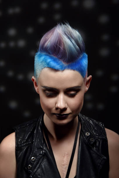 istock Studio fashion creative model portrait with short colored blue and gray hair 954306270