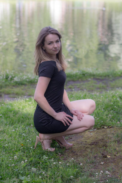 istock girl in a black dress 954307138