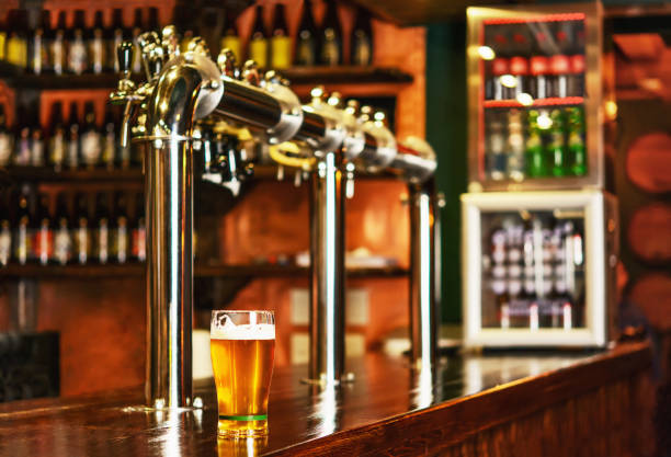 istock Pint of beer on a bar in a traditional style pub 954311020