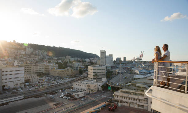The sun is rising on the hill behind the city, Haifa