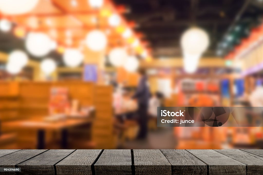 Empty wooden shelf display with Izakaya japanese restaurant background Izakaya Stock Photo