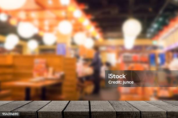 Empty Wooden Shelf Display With Izakaya Japanese Restaurant Background Stock Photo - Download Image Now