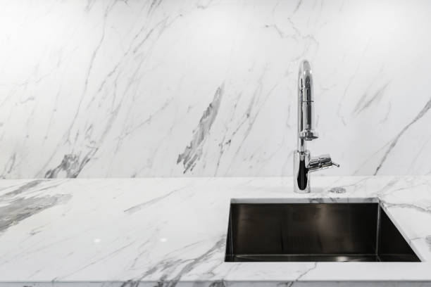istock close up sink or lavatory with white marble counter interior background 954315242