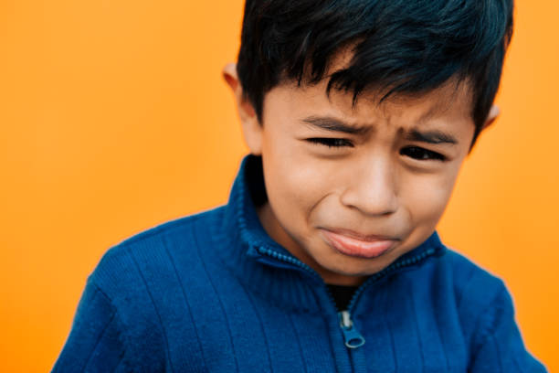 istock Portrait of a sad little boy 954316848