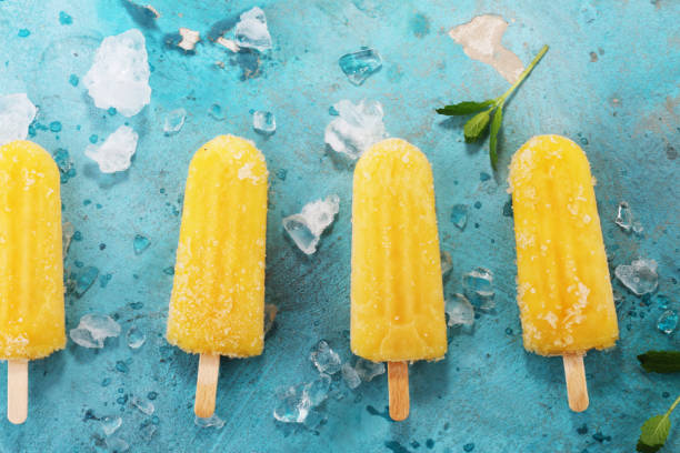 istock Colorful orange popsicle mango banana flavour 954330430