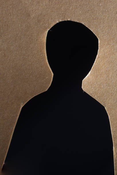 istock Man shape cut out of paper in hand 954330776